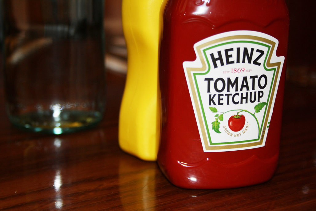 Heinz ketchup brand bottle on a table